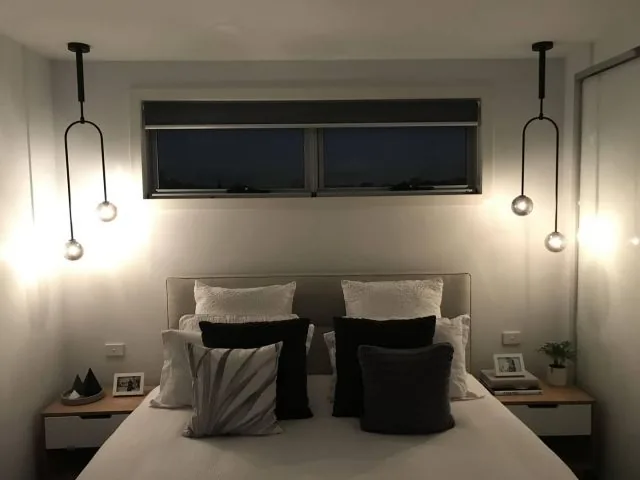 Bedside pendant lights installed by JR Dixon Electrical on either side of a bed