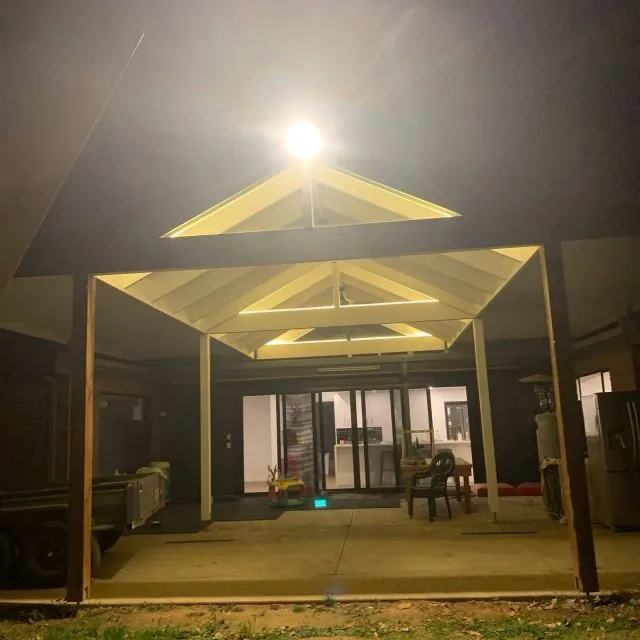 JR Dixon Electrical pergola lighting with LED strips and a floodlight illuminating the yard