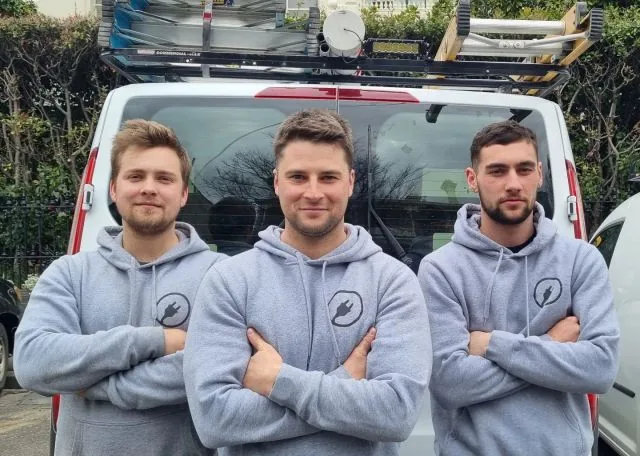 The JR Dixon Electrical team beside their work van
