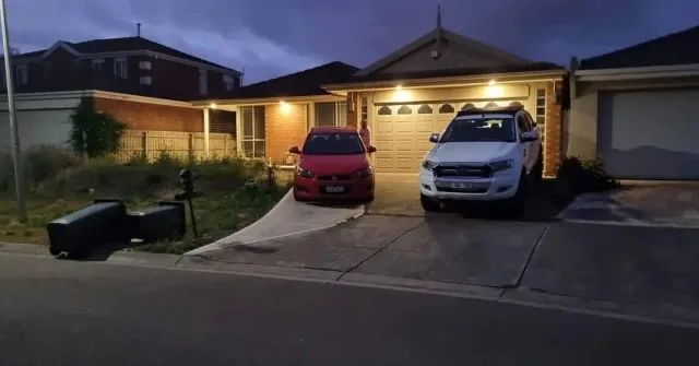 JR Dixon Electrical exterior downlights illuminating the eaves and driveway of a home